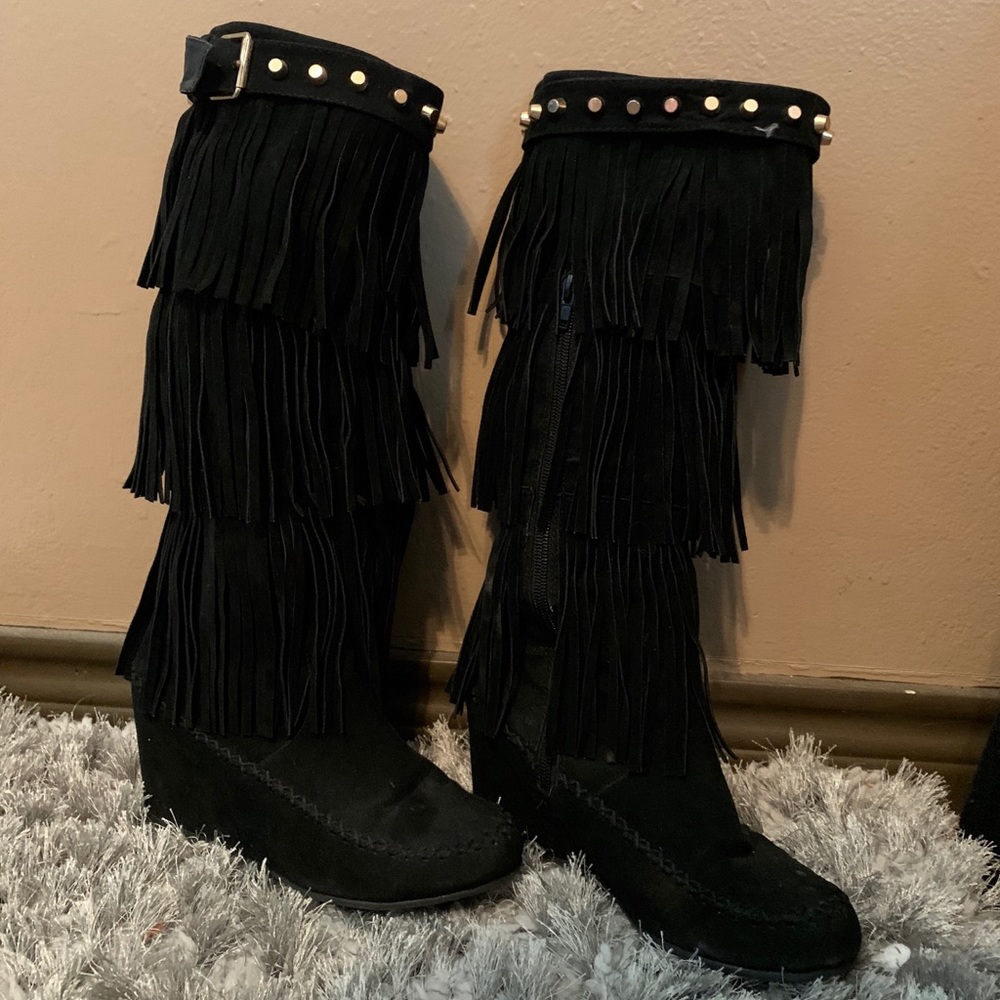 Black moccasin boots with fringe
